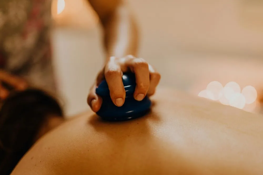 Cupping therapy with cups placed on a person's back.