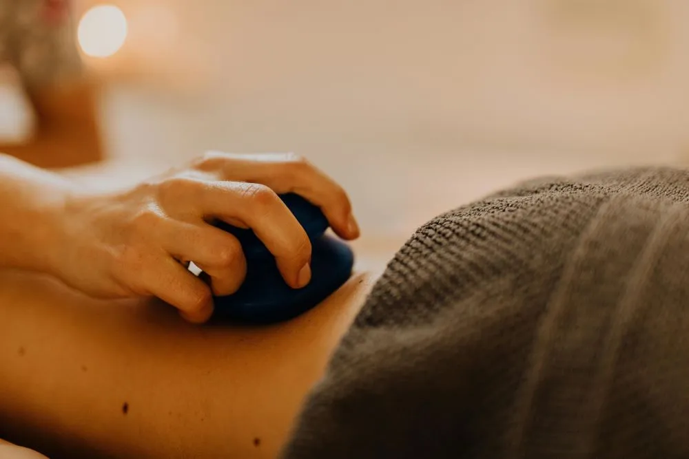 A therapist applying myofascial release techniques.