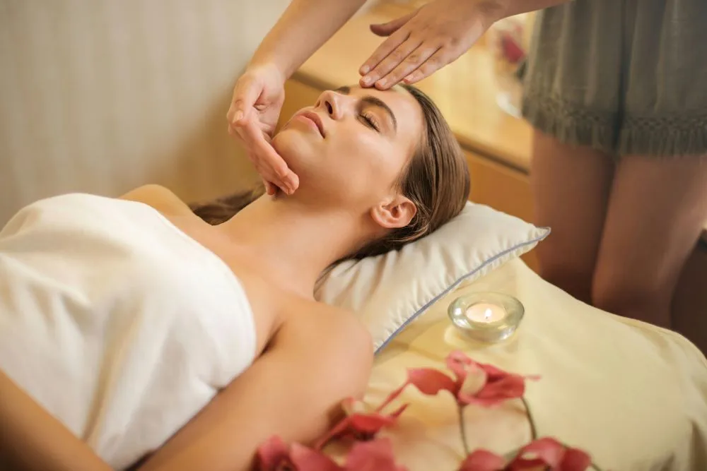 A person lying on a massage table during a relaxation massage.